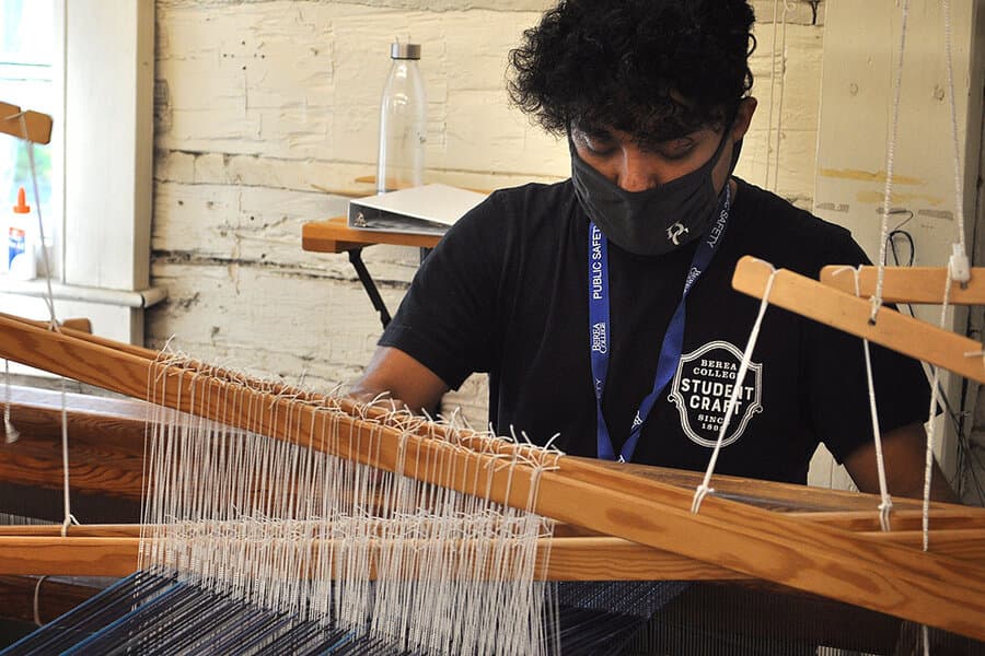 Photo of Student Edgar Ortiz weaving