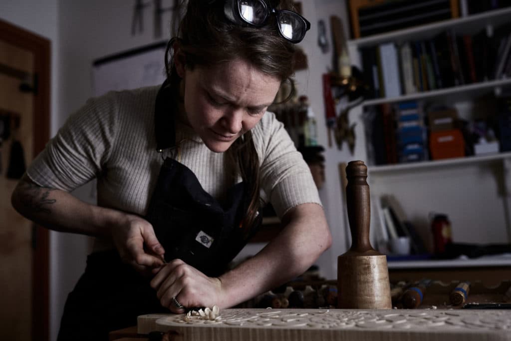 Aspen Golann carving wood