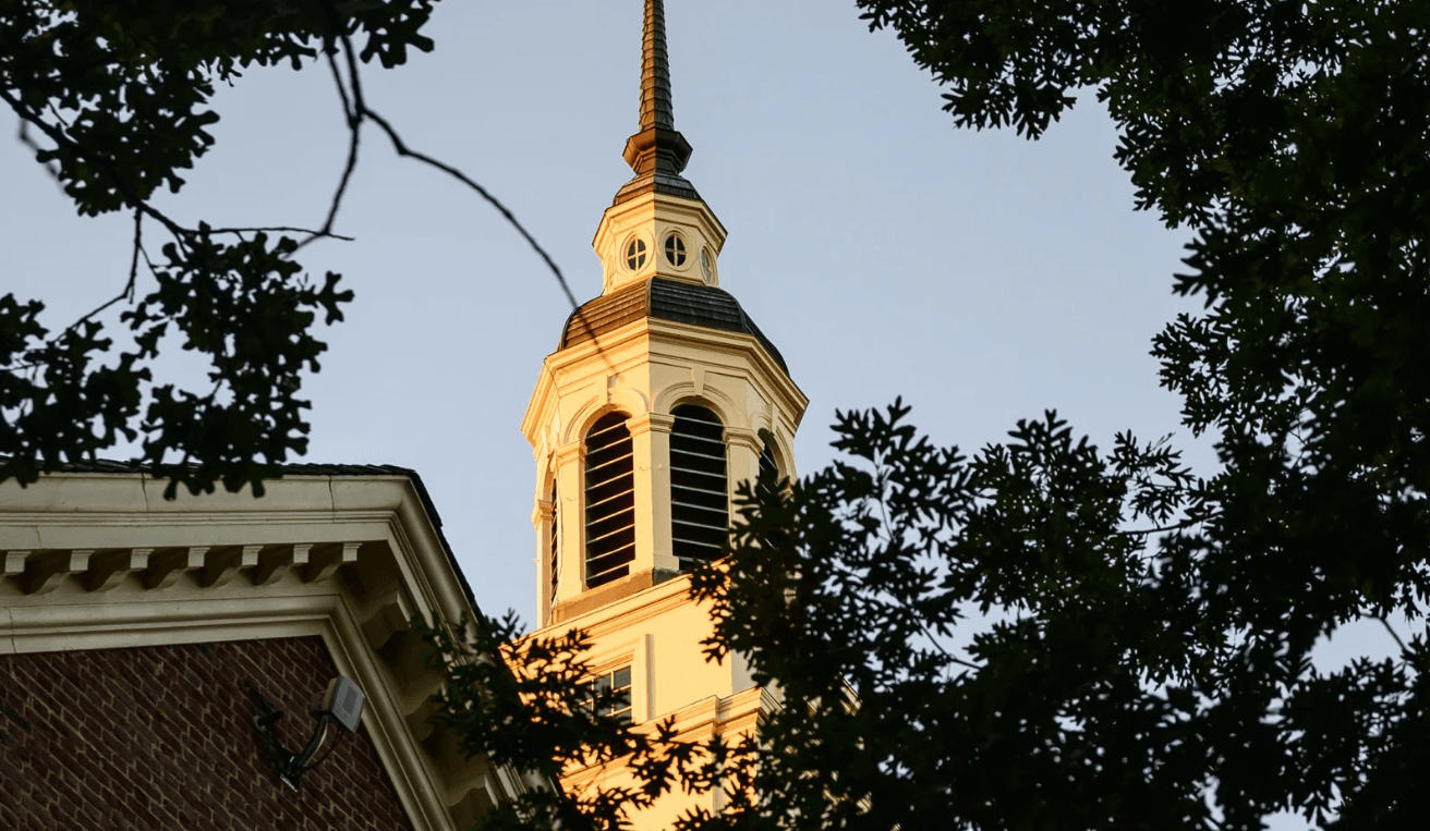 Picture of Draper Building the top part surrounded by trees.