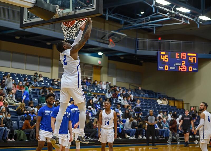 Photo of Basketball player dunking