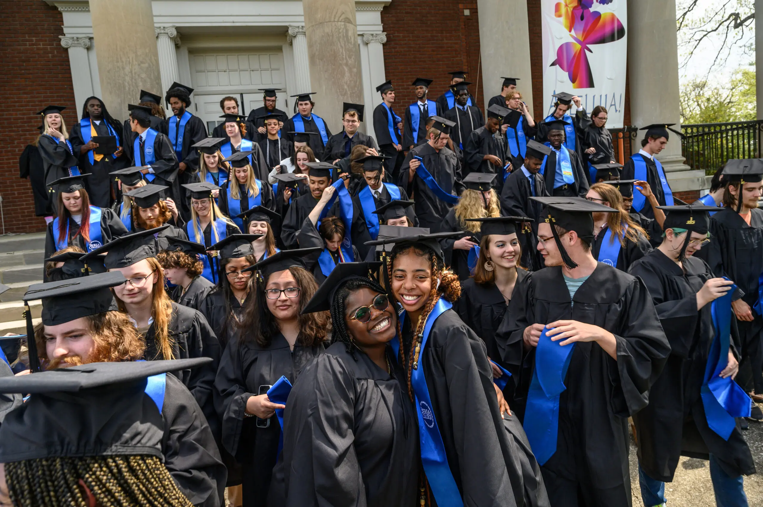 Students at commencement in their caps and gowns.
