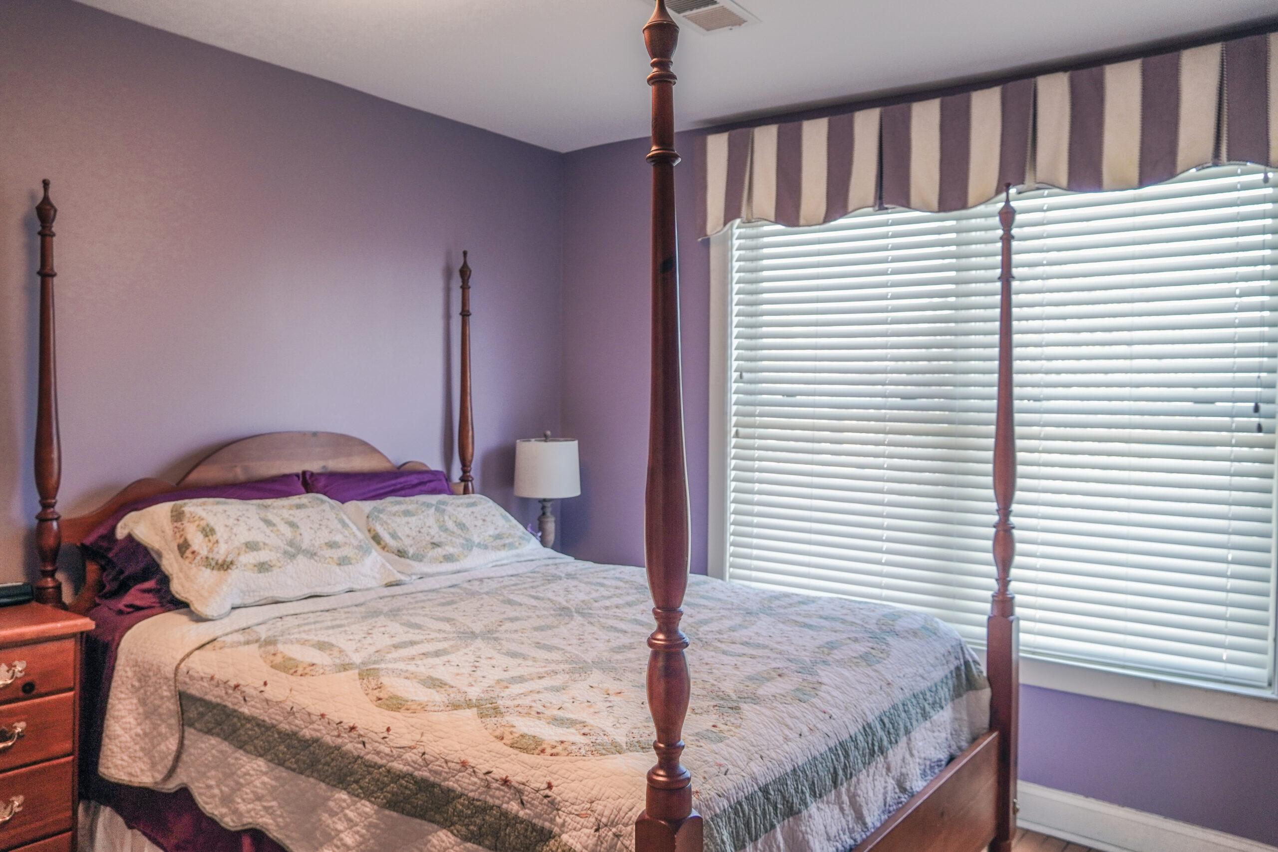 The purple bedroom in Sturt Cottage.