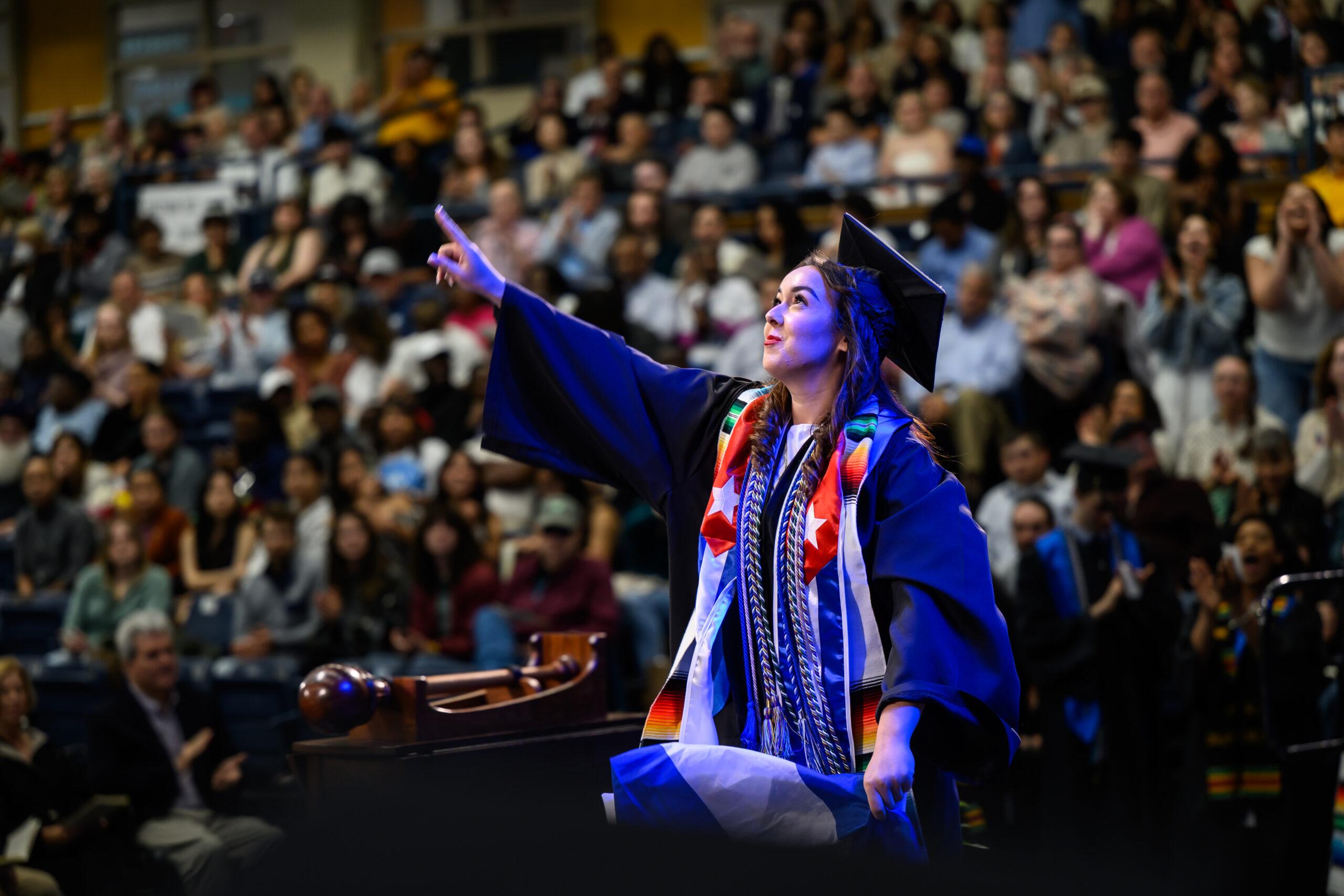 A Berea College student crosses the stage at graduation