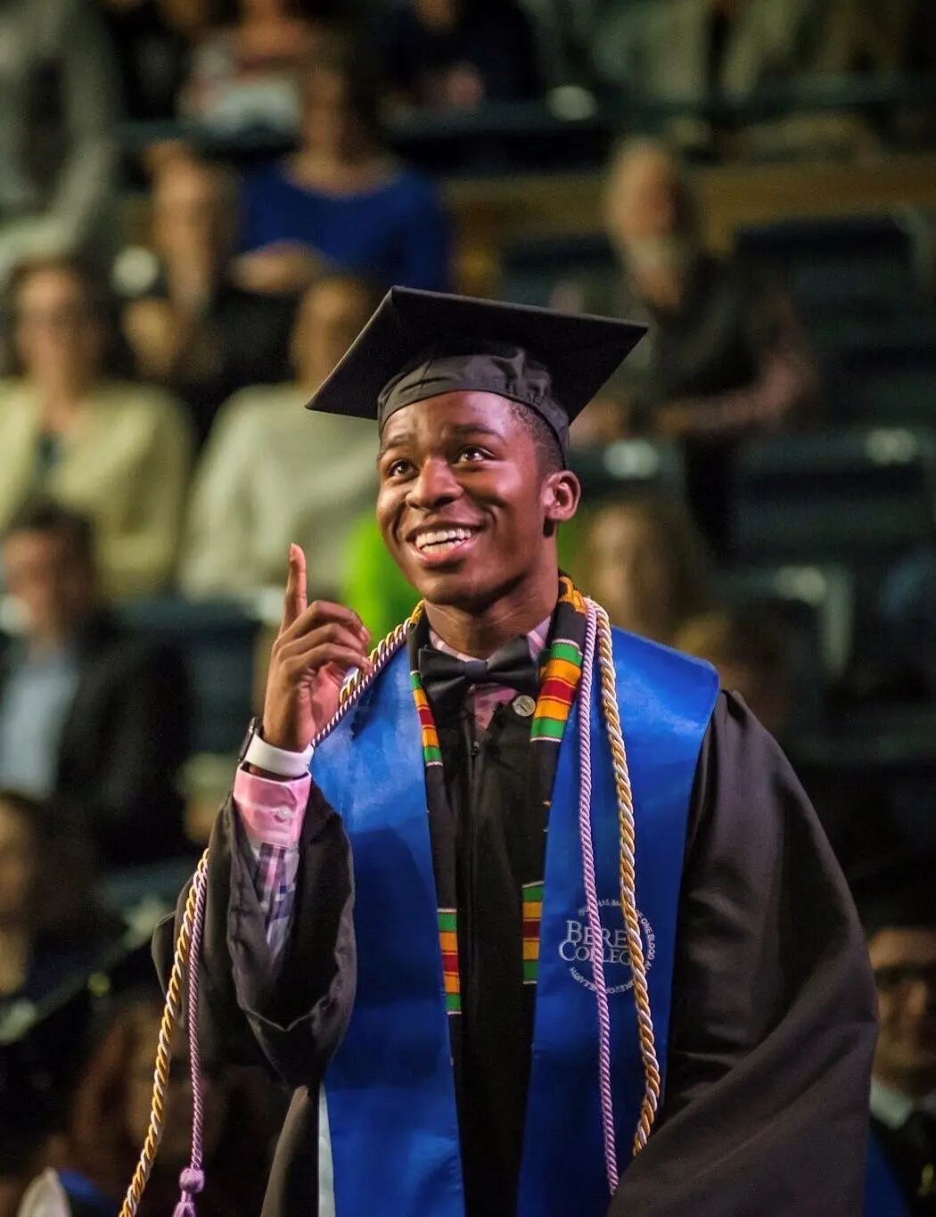 Anthony Myrks-Brewer '17 points to the sky in gratitude as he walks across the stage at graduation.